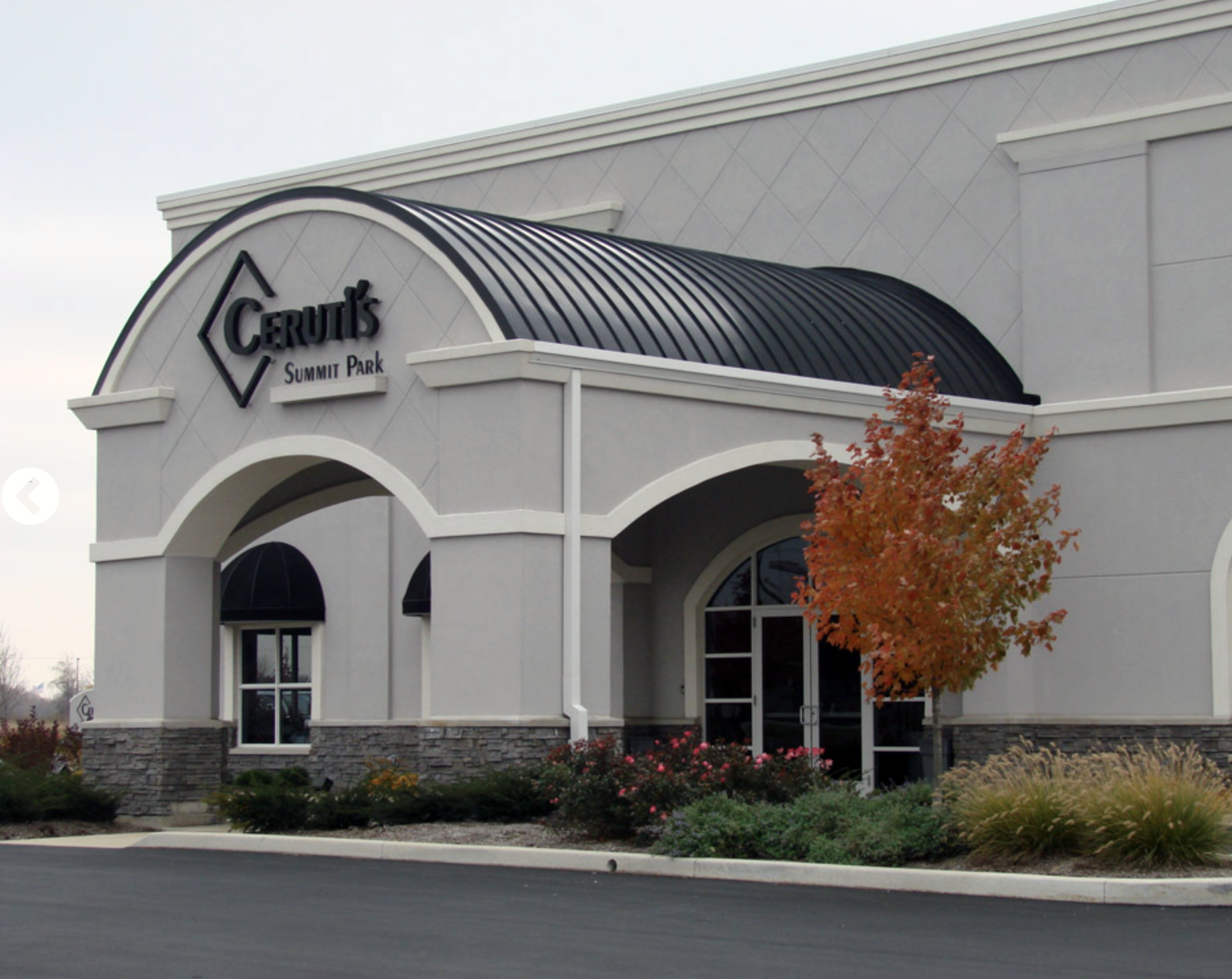 Exterior of Ceruti’s at Summit Park wedding and event venue in Fort Wayne, Indiana, featuring the main entrance and landscaped grounds.