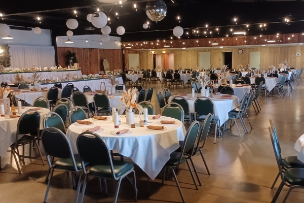The Reserve Hall wedding reception venue in northeast Fort Wayne, Indiana, featuring spacious banquet seating, round tables, and elegant overhead lighting.